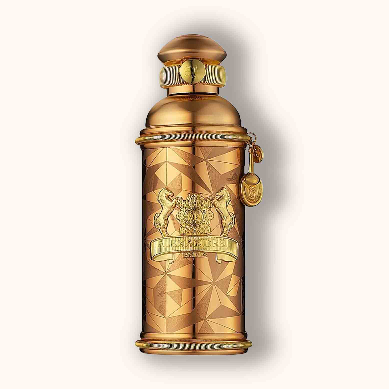Alt text: A luxurious golden bottle of Alexandre.J Golden Oud, featuring an intricate geometric pattern and a decorative cap, exudes elegance and sophistication.