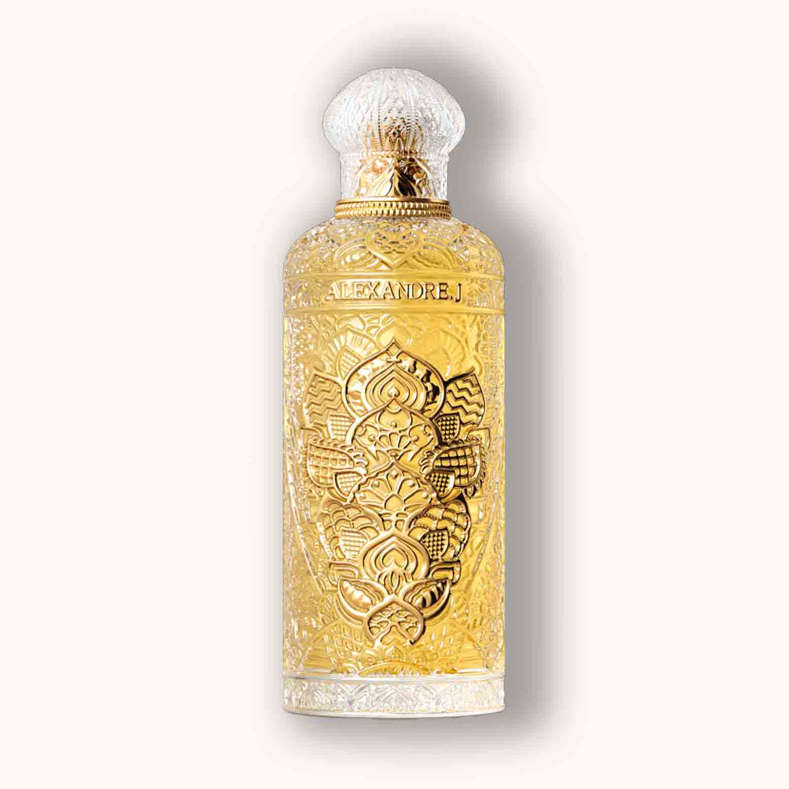 Alt text: A beautifully ornate bottle of Alexandre.J Gold Ode to Rose, featuring intricate Bloemig engravings and a golden hue. The design reflects elegance and luxury, making it a stunning addition to any fragrance collection.