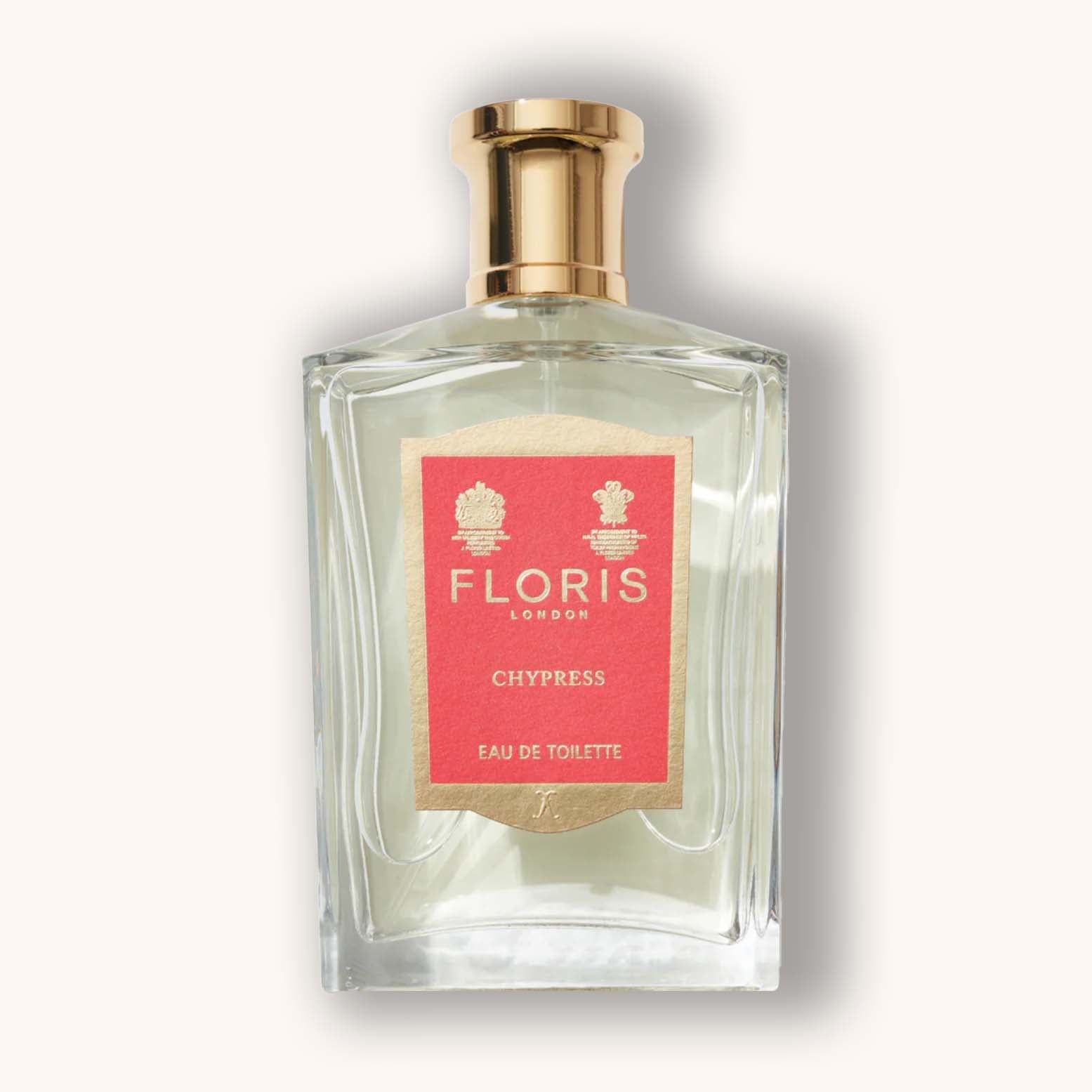 Alt text: A clear glass bottle of Floris London Chypress Eau de Toilette, featuring a gold cap and a distinct coral label with elegant Bloemig accents.