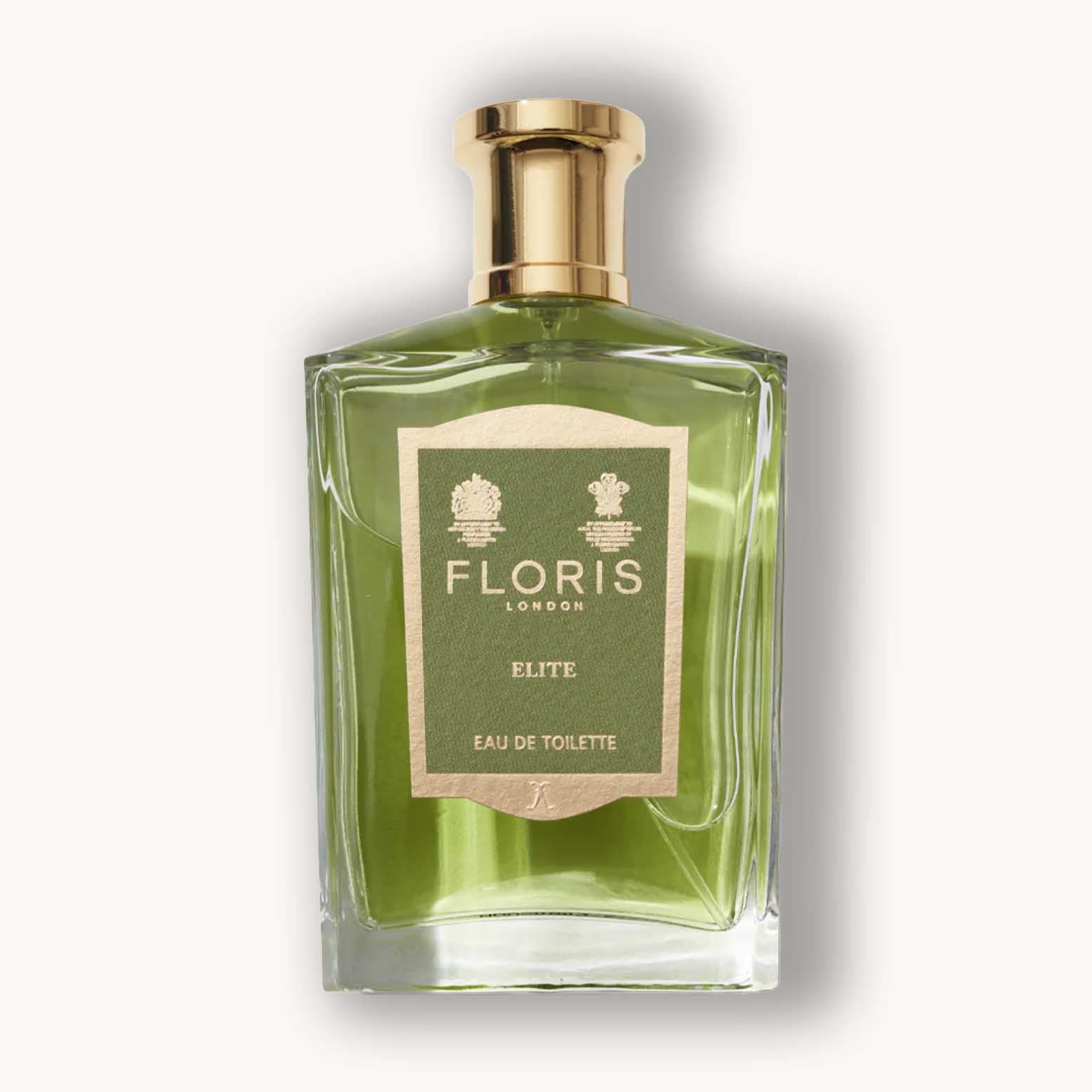 Alt text: A stylish glass bottle of Floris London Elite Eau de Toilette, featuring a green hue and a gold cap, highlighted by a simple label with gold lettering.