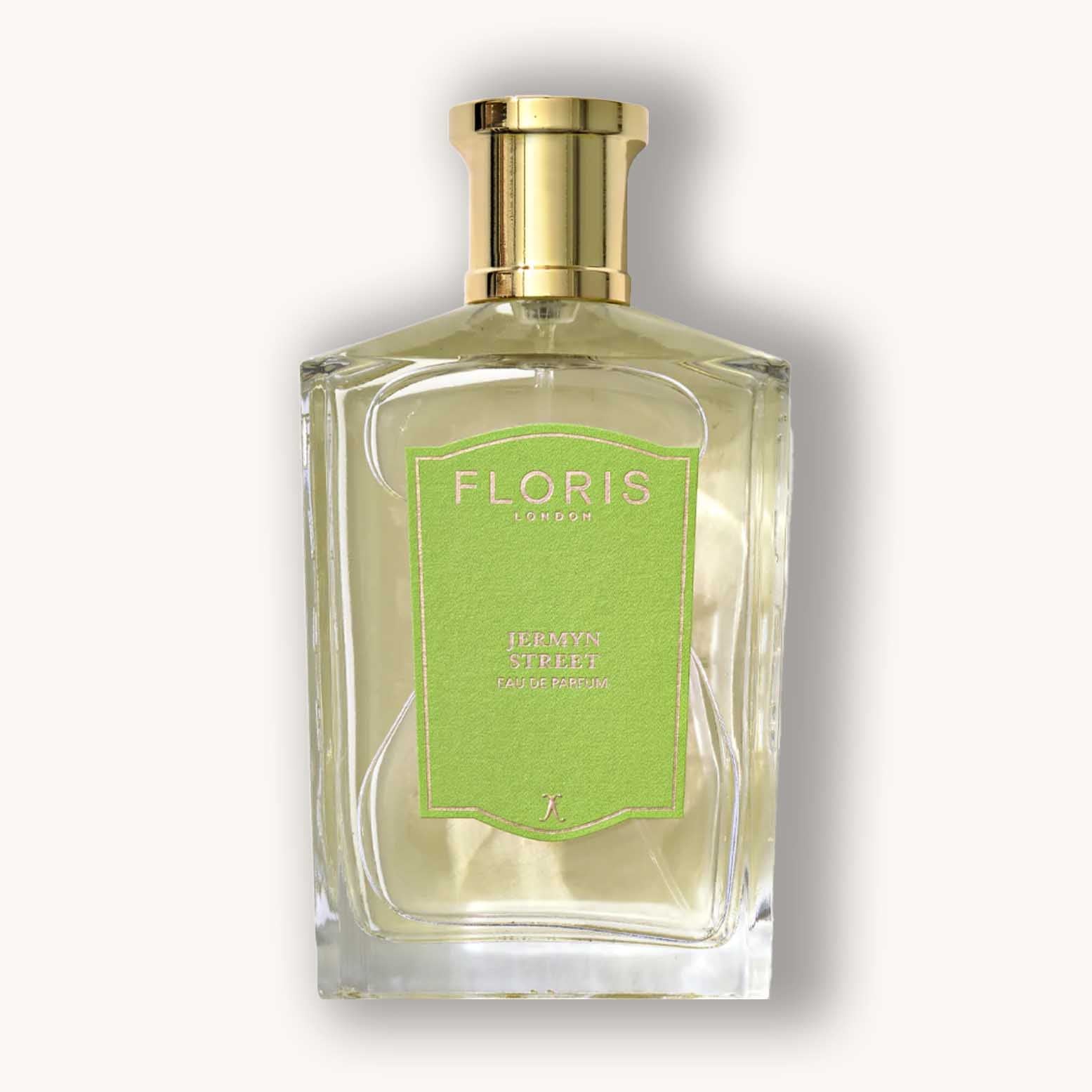 Alt text: A stylish glass bottle of Floris London Jermyn Street perfume, featuring a vibrant green label and a sleek gold cap, embodying a sophisticated fragrance experience.