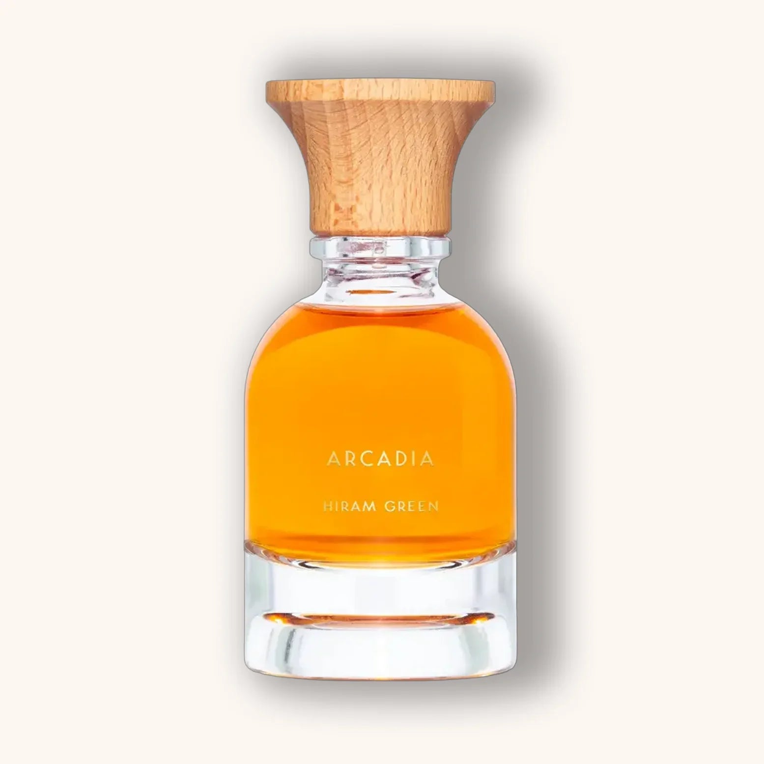 Arcadia natuurlijke parfum van Hiram Green in een warme oranje tint met een houtstructuur dop.