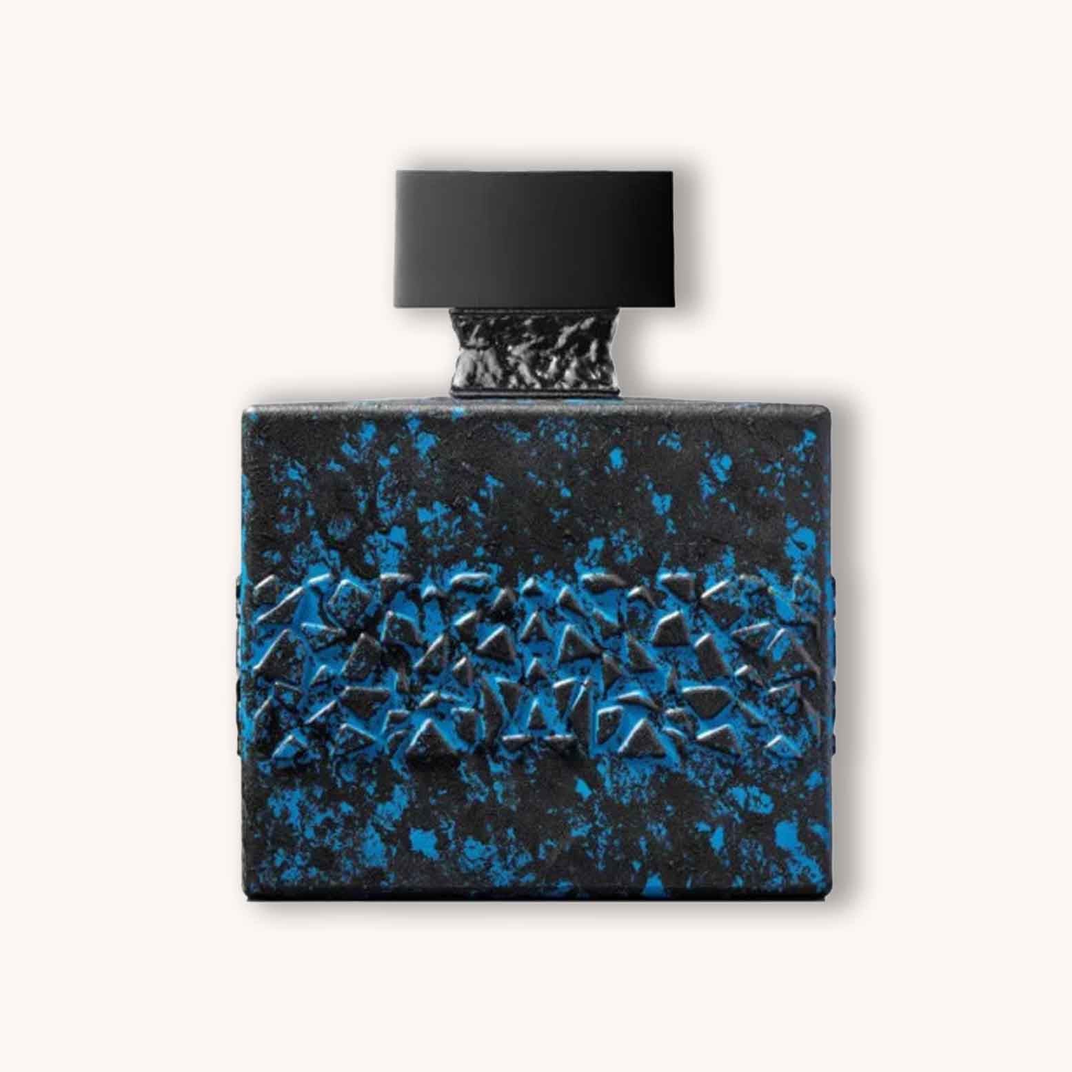 Alt text: A striking perfume bottle of M. Micallef DesirToxic L'Intense featuring a textured black design with blue accents, topped with a sleek black cap. The bottle's unique shape and vibrant color contrast create an eye-catching aesthetic.