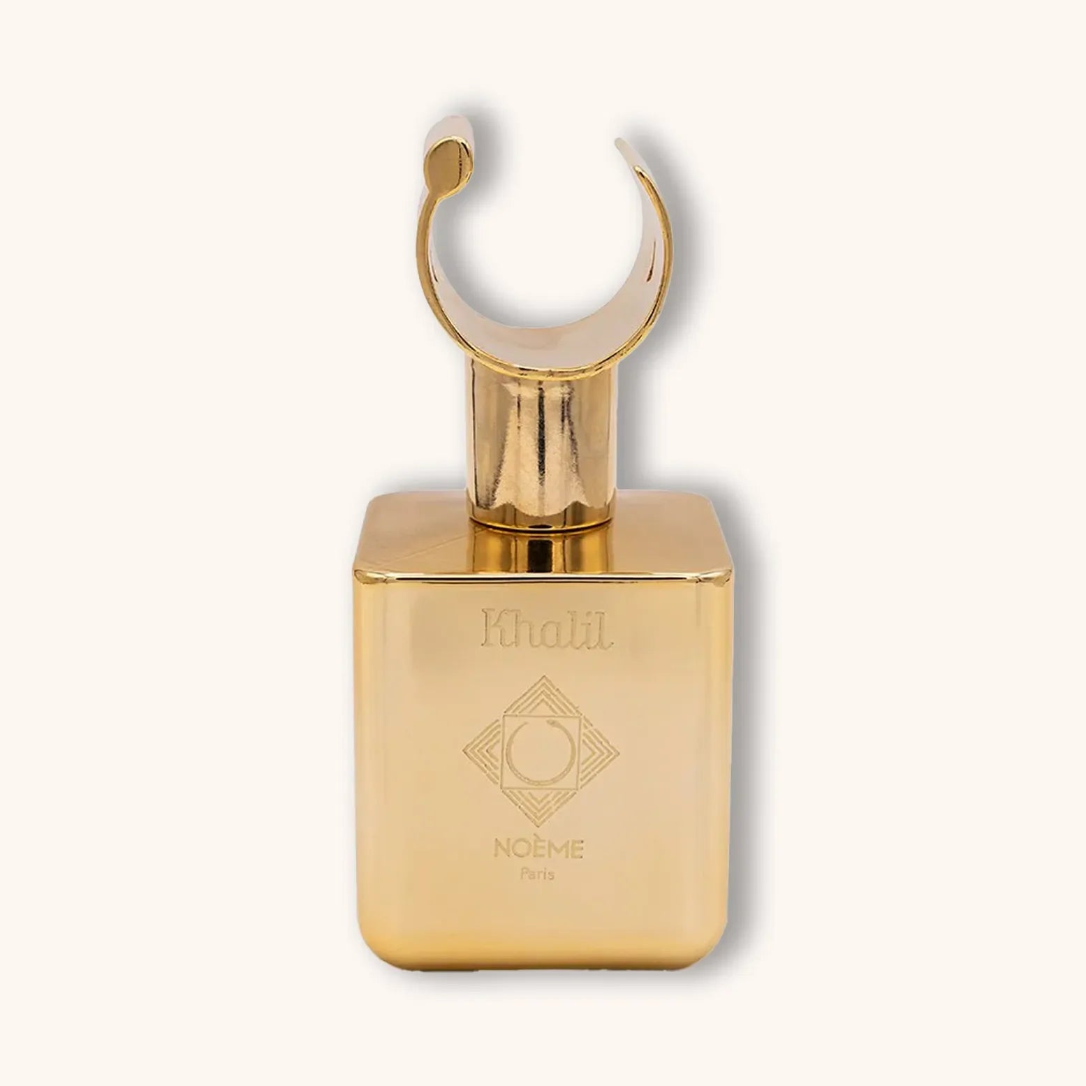 Alt text: A luxurious golden bottle of Noème Paris Khalil perfume, featuring an elegant curved cap and a square base, exuding sophistication and allure.