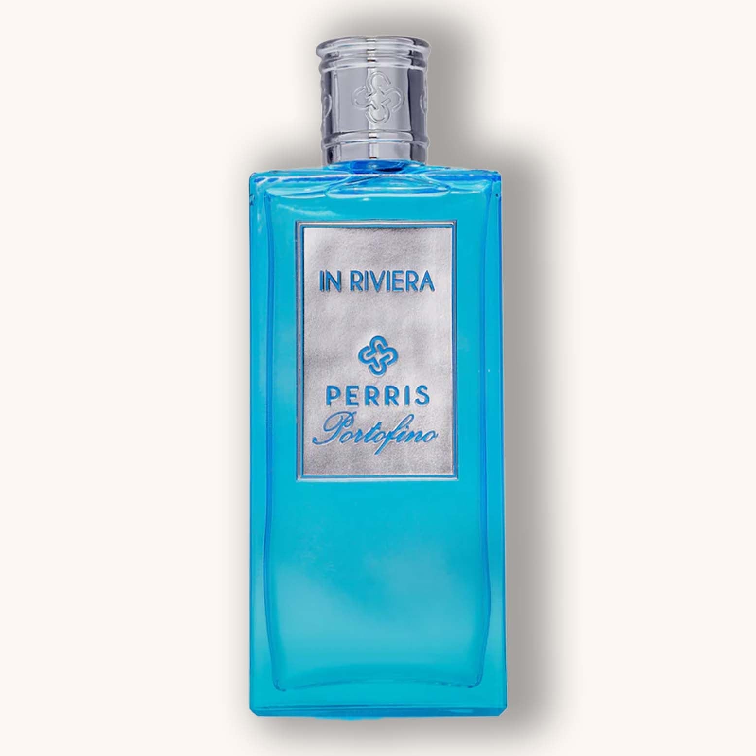 A vibrant blue bottle of Perris Portofino In Riviera fragrance, featuring a sleek design with a silver label prominently displaying the brand name. The elegant packaging suggests a refreshing and luxurious scent inspired by the Italian Riviera.