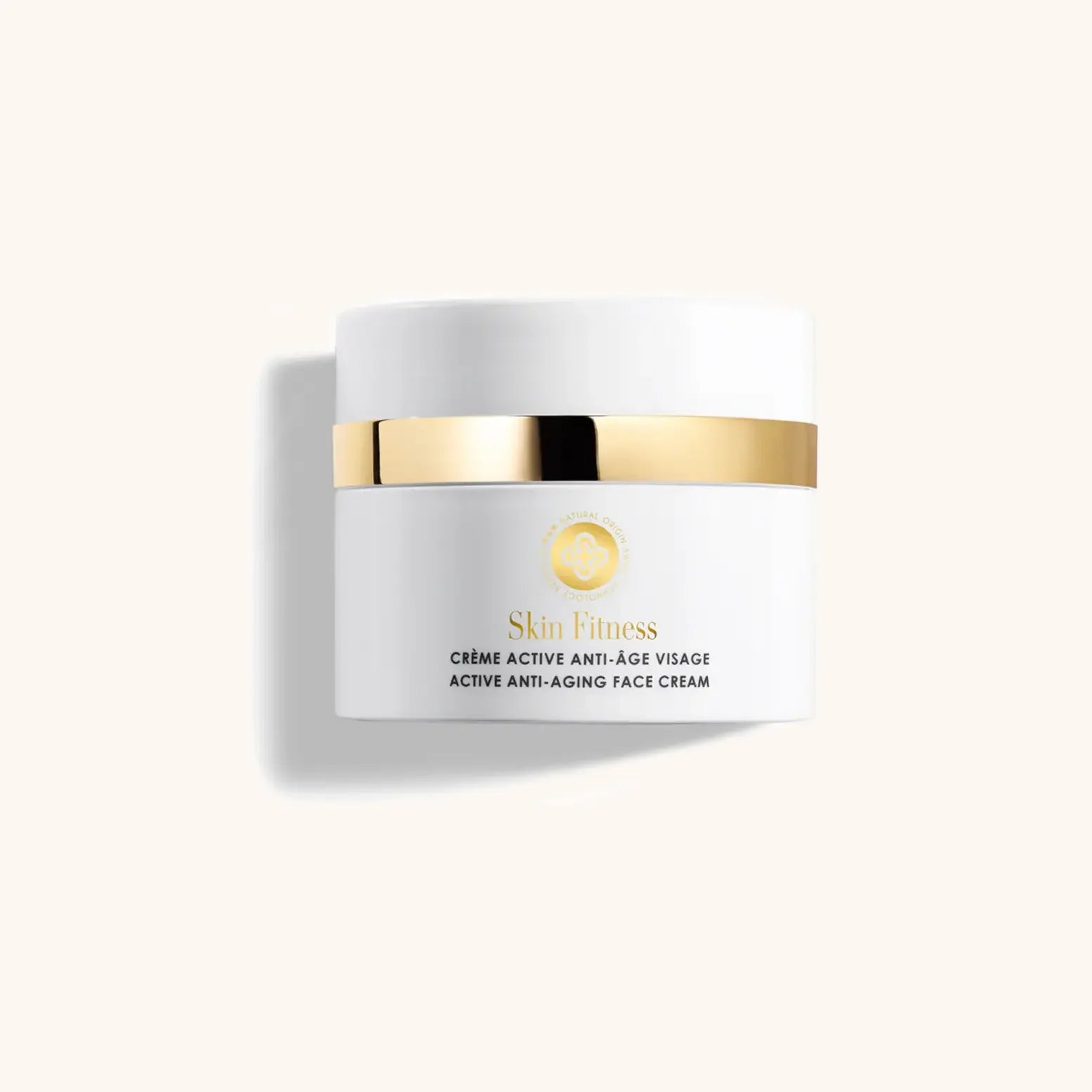 Alt text: A sleek, white jar of Perris Swiss Laboratory Active Anti-Aging Face Cream, featuring a gold band, positioned against a neutral background. The label prominently displays "Skin Fitness" and "Active Anti-Aging Face Cream."