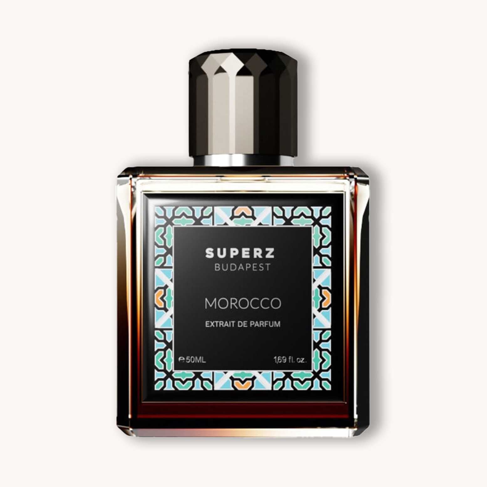 Alt text: A sleek bottle of Superz Morocco perfume, featuring an elegant design with a geometric pattern, showcasing a rich, dark liquid inside. The bottle is labeled with "SUPERZ BUDAPEST" and "MOROCCO EXTRACT DE PARFUM."