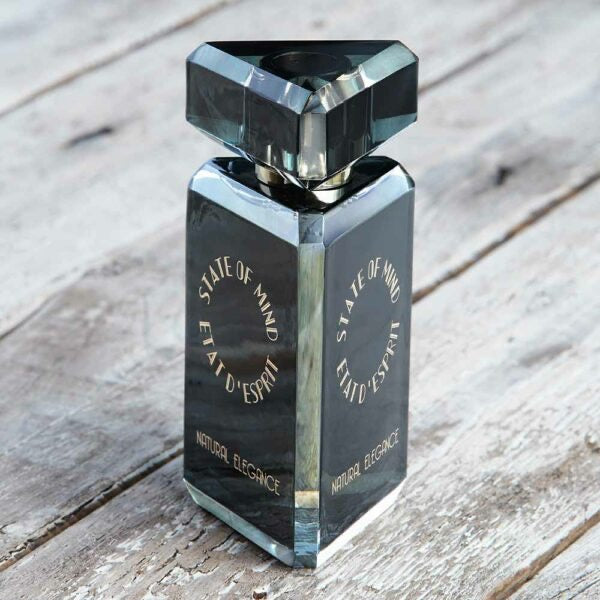 Promo photo of the bottom of the perfume bottle of State of Mind Natural Elegance