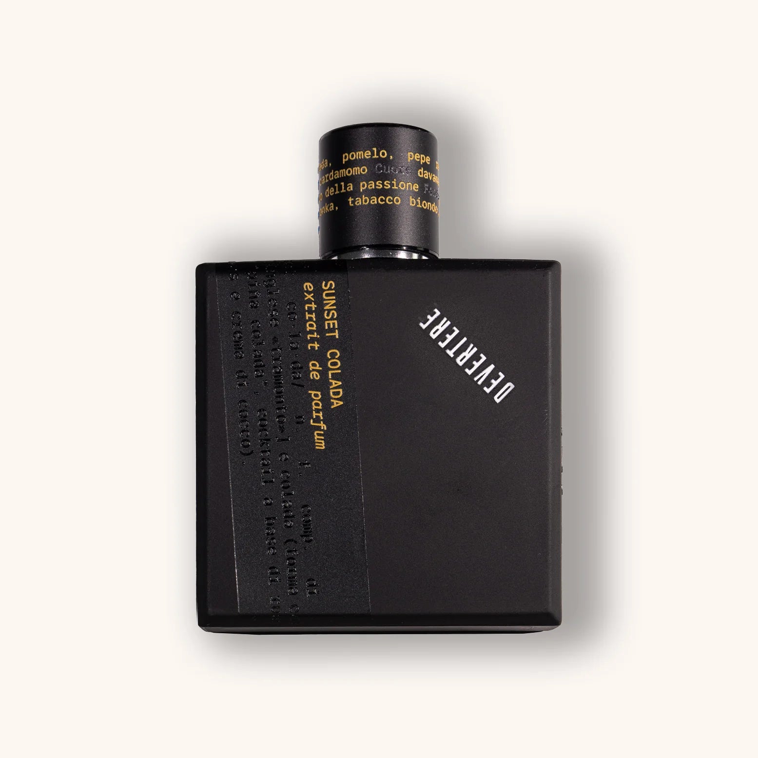 Black perfume bottle of Devertere Sunset Colada with yellow text on a white background