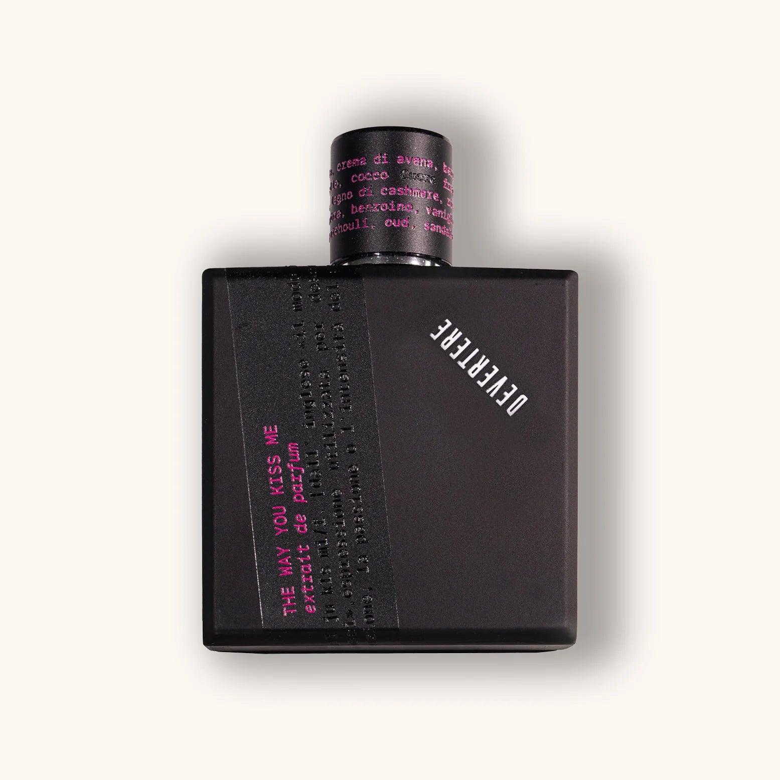 Black perfume bottle of Devertere The Way You Kiss Me with pink text on a white background