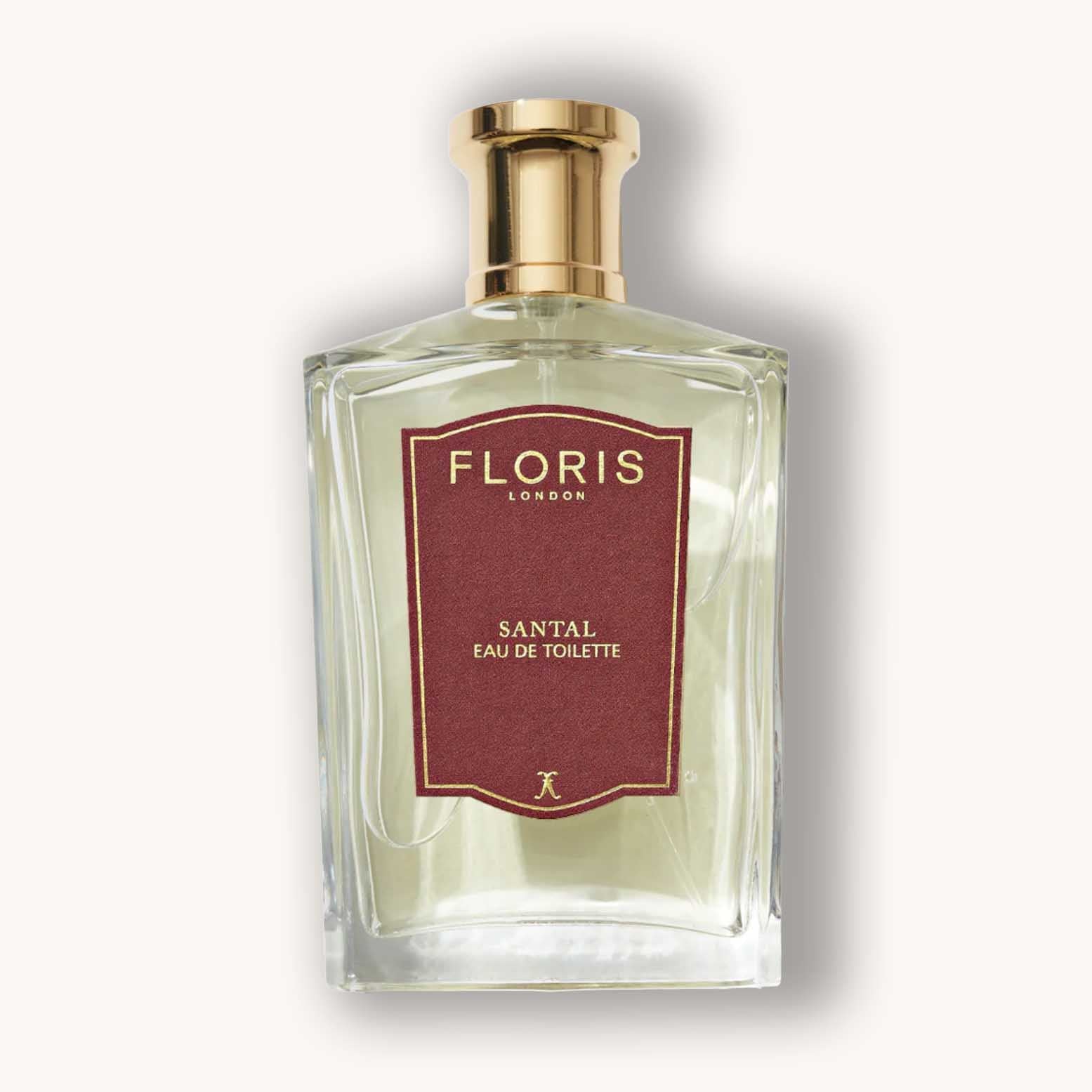 A glass bottle of Floris London Santal Eau de Toilette, featuring a classic design with a gold cap and a rich maroon label. The fragrance exudes a warm, Houtig aroma ideal for any occasion.