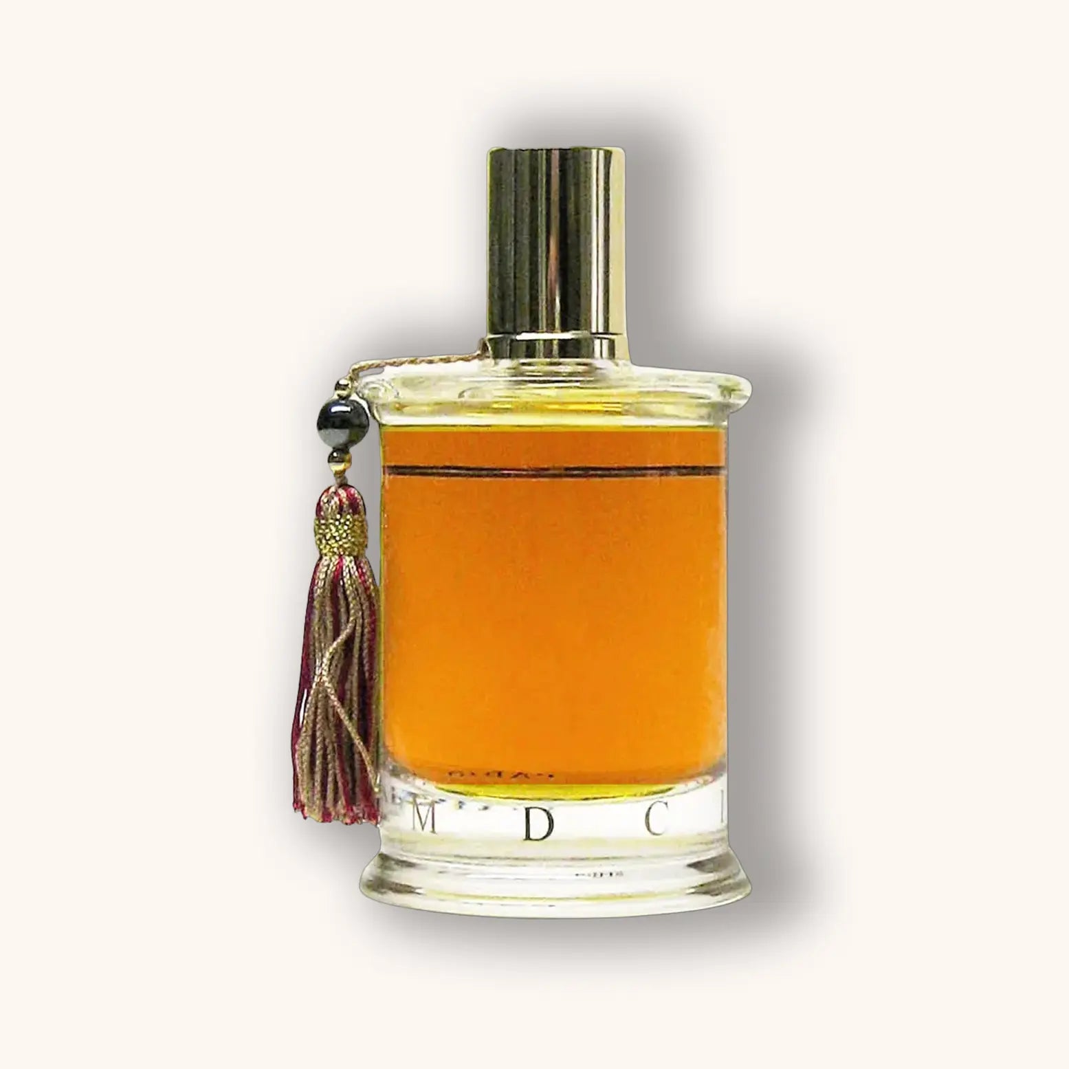 Bottle of MDCI Chypre Palatin perfume featuring a rich amber liquid and dark red tassel.