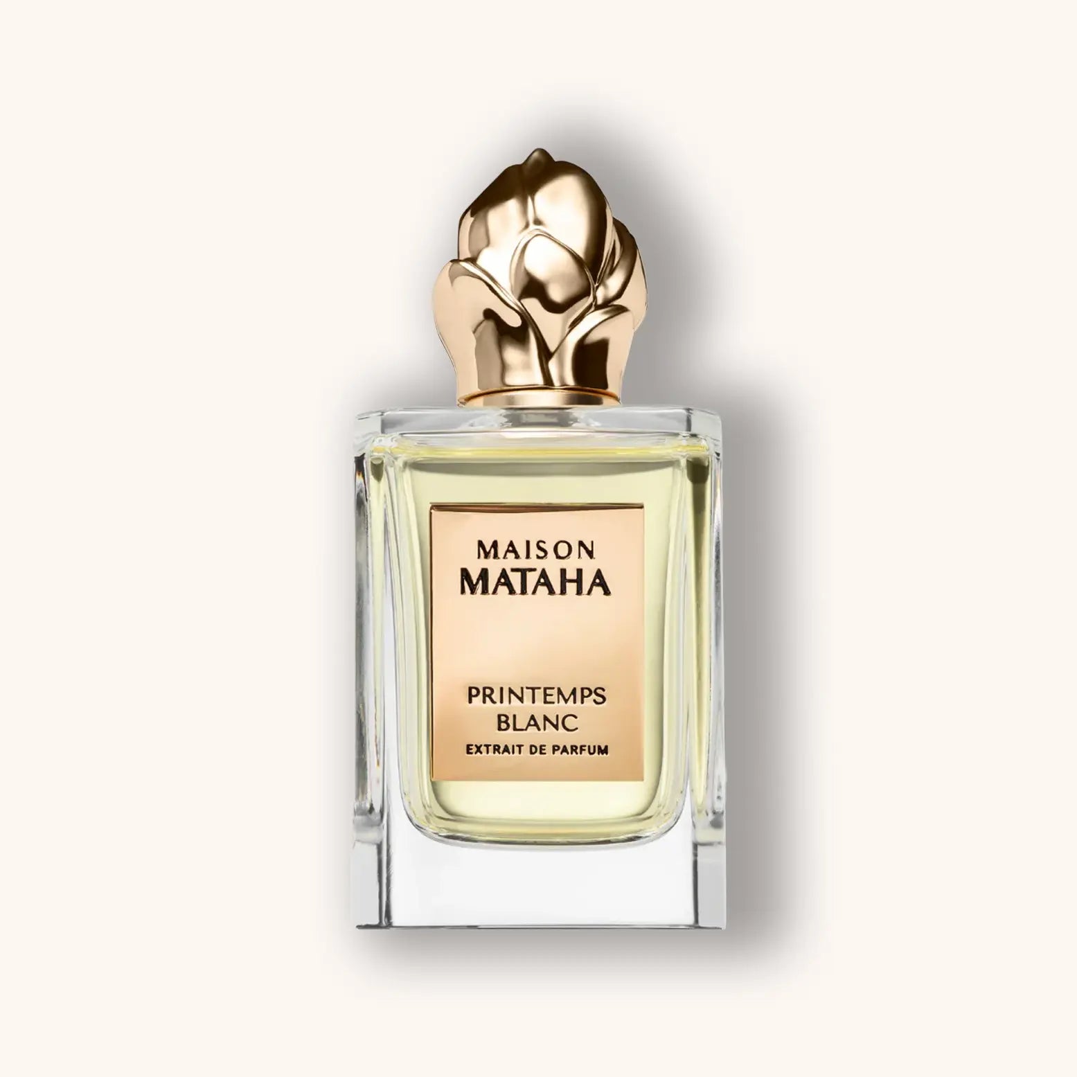 Flacon van Maison Mataha Printemps Blanc Extrait de Parfum met gouden bloemvormige dop en elegante transparante glazen fles.