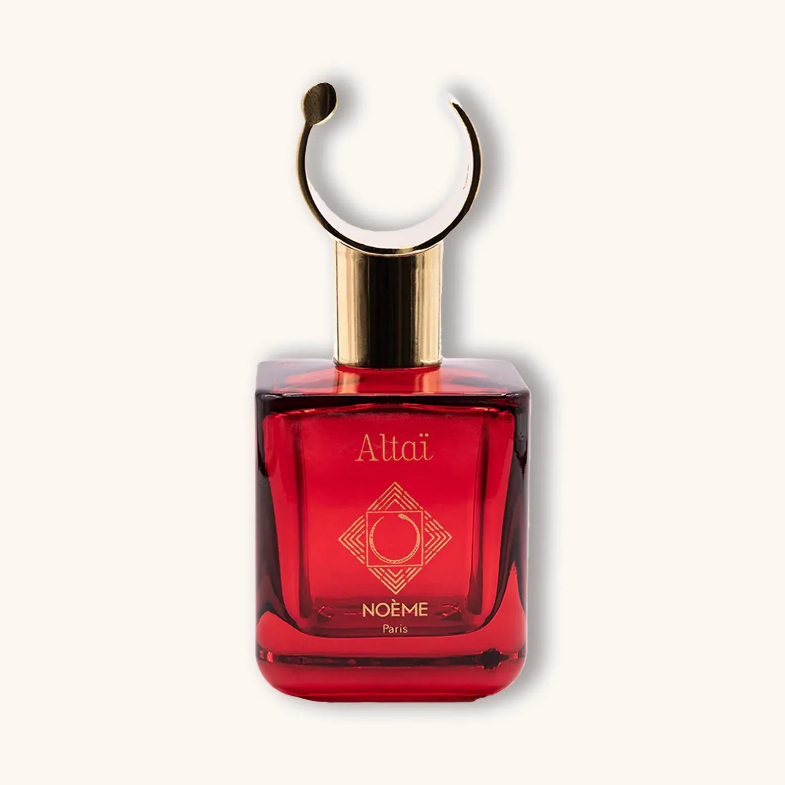 Alt tag: A luxurious bottle of Noème Paris Altaï perfume, featuring a striking red glass design and an elegant gold cap with a unique circular handle. The brand logo is prominently displayed on the front.