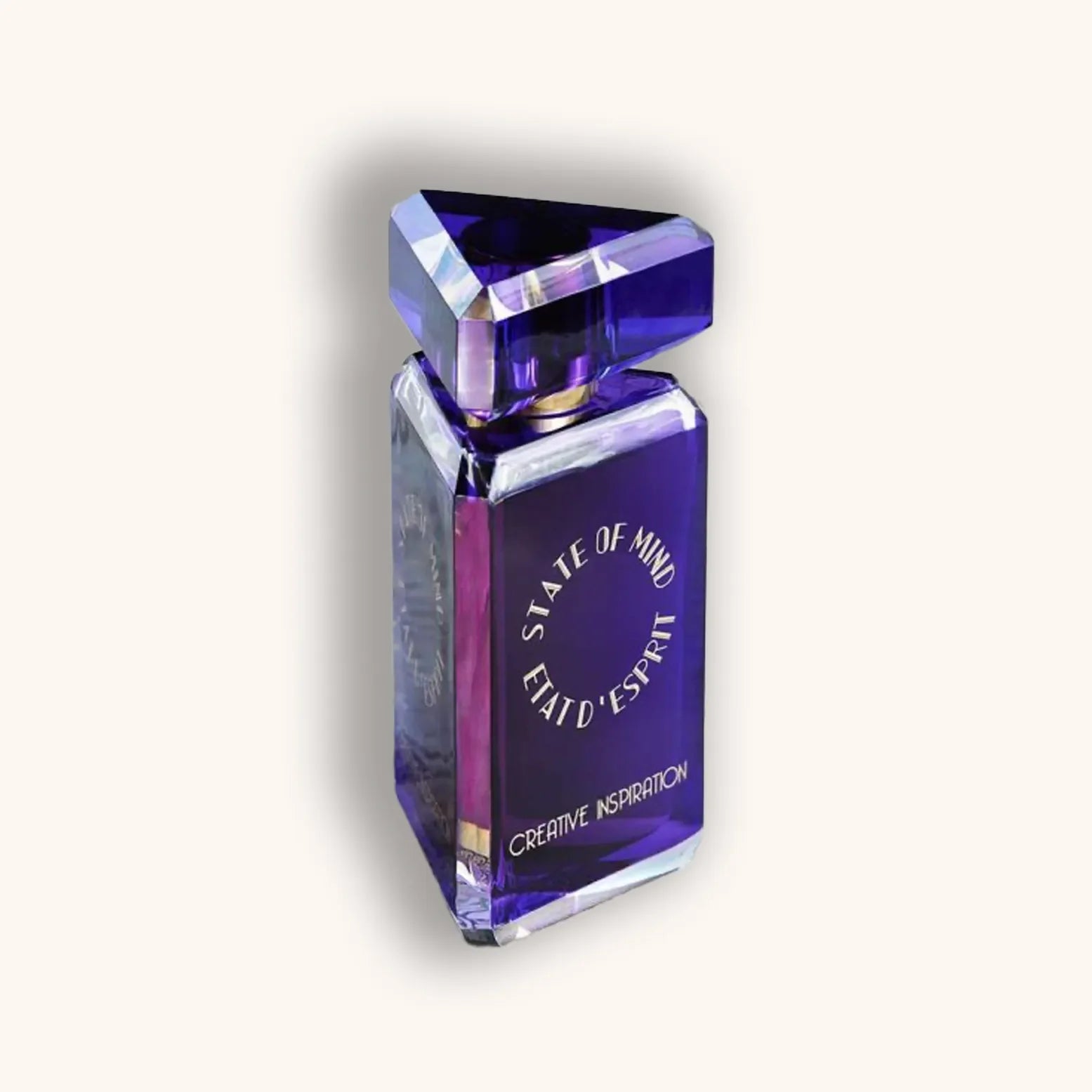 A visually striking purple perfume bottle with a triangular cap, labeled "State of Mind Creative Inspiration." The design combines elegance and creativity, reflecting the essence of artistic inspiration.