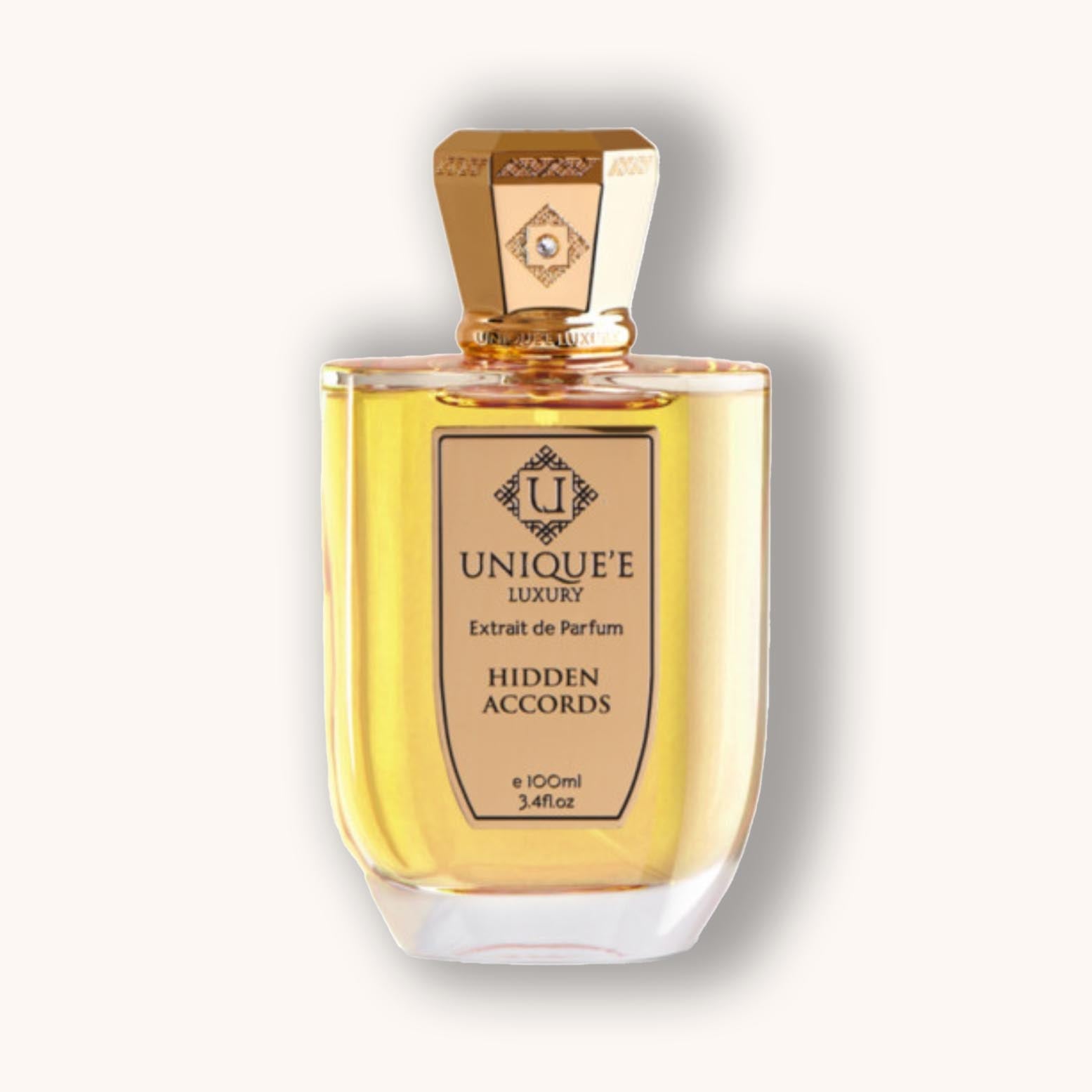 A bottle of Unique'e Luxury Hidden Accords Extrait de Parfum, showcasing its elegant design with a gold cap and a golden liquid inside. The 100ml bottle exudes sophistication and luxury.