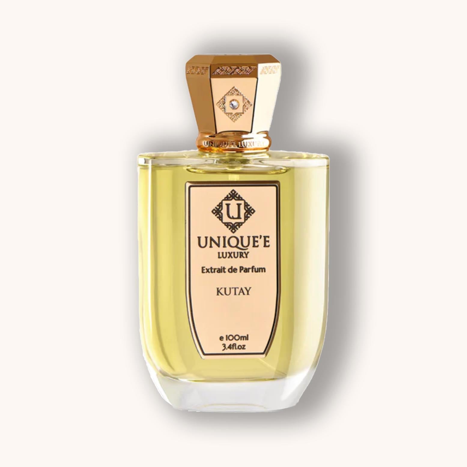 Alt text: A luxurious perfume bottle named "Unique'e Luxury Kutay," featuring a golden cap and a sleek design, containing 100ml of fragrant extrait de parfum.